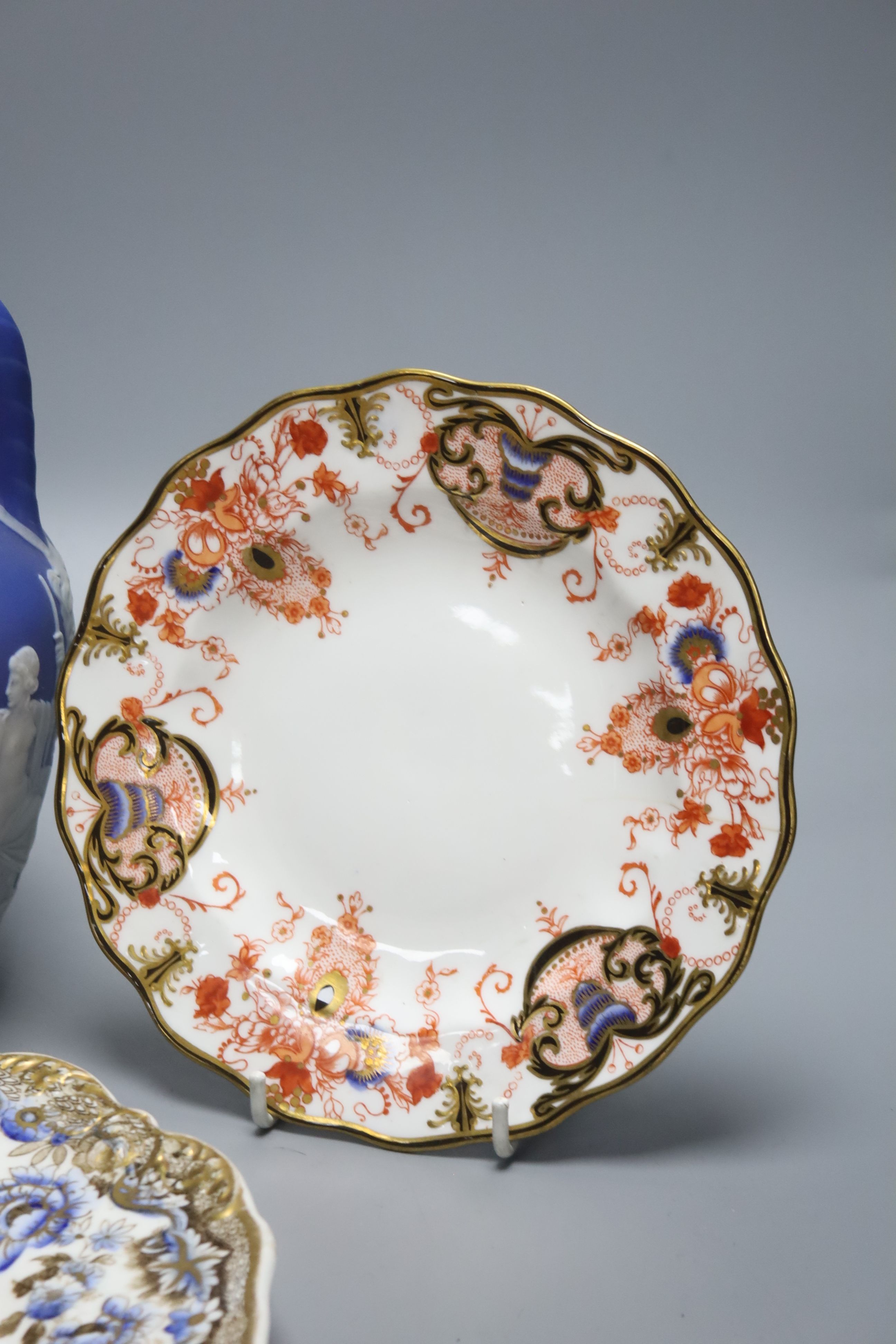 A Wedgwood jasperware Portland vase, 19th century, height 21cm, and four Victorian plates to include Spode and Royal Crown Derby